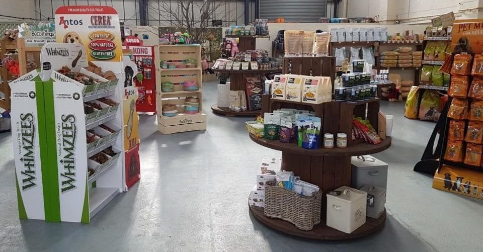 Inside the Posh Petz store, with displays of treats and natural foods